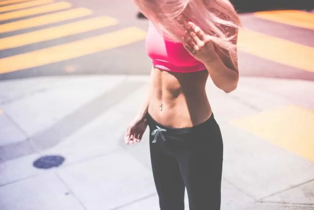 Woman with toned stomach after LA-EMS Body Sculpting Treatment Thame