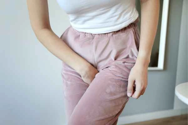 woman running for the toilet because of urinary incontinence Thame